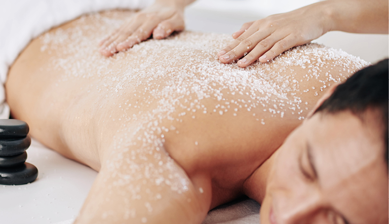Professional Body Scrub Massage treatment with essential oils in serene spa environment